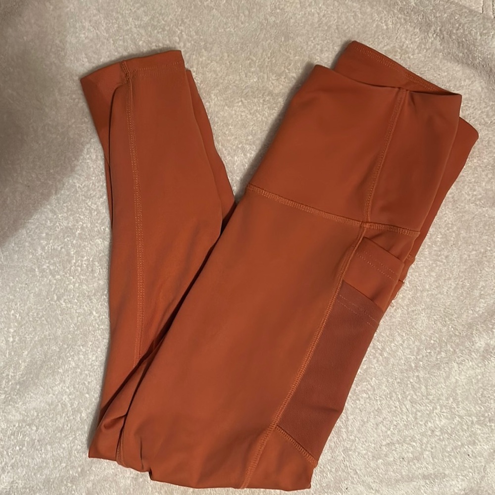 NWOT BSP orange leggings SIZE MEDIUM